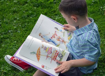 Young Boy Reading Book